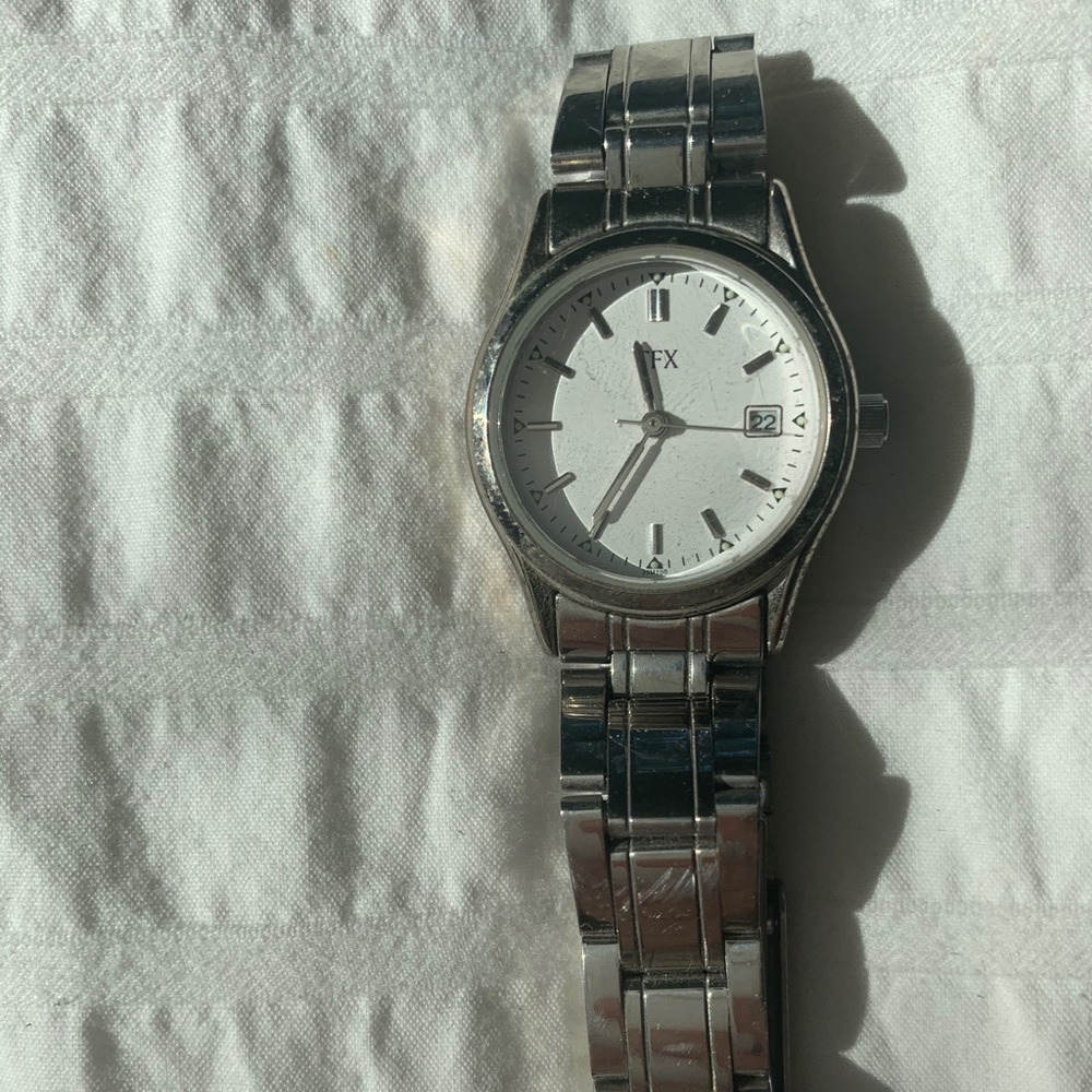 Small silver watch + extra links